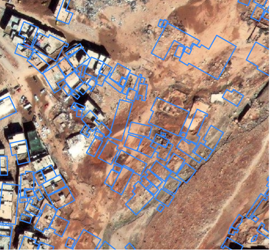 Figure 15: In this image, the blue lines represent buildings that were present prior to the flood. When the blue outlines are overlain on top of the satellite imagery from after the flood, it becomes abundantly clear which buildings were destroyed and which remain intact (Open Data, 2023). If you would like to learn more about flood mapping, read this article or have a look at available online trainings