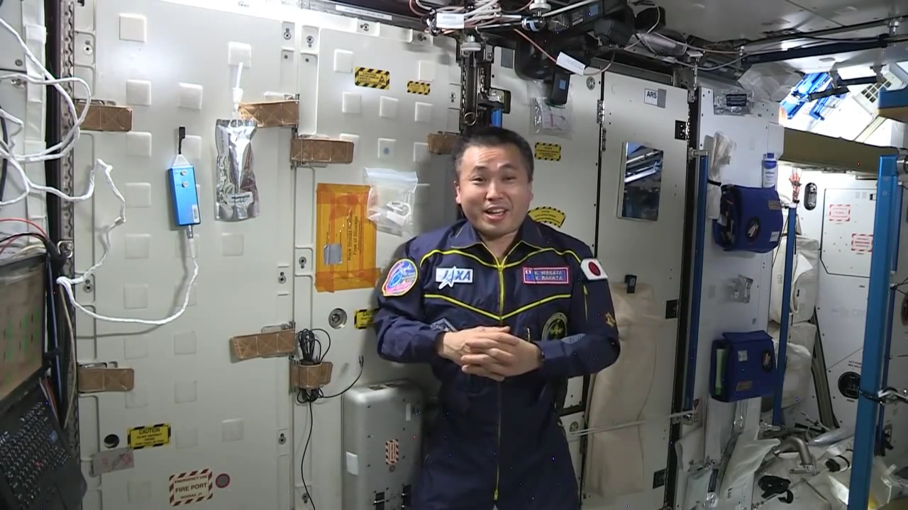 Japan Aerospace Exploration Agency astronaut Koichi Wakata standing in front of the Water Recovery System on the ISS (NASA Johnson, 2014)