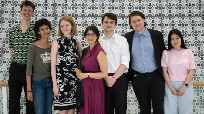 Photo of six UNOOSA interns with Aarti Holla-Maini, Director of UNOOSA