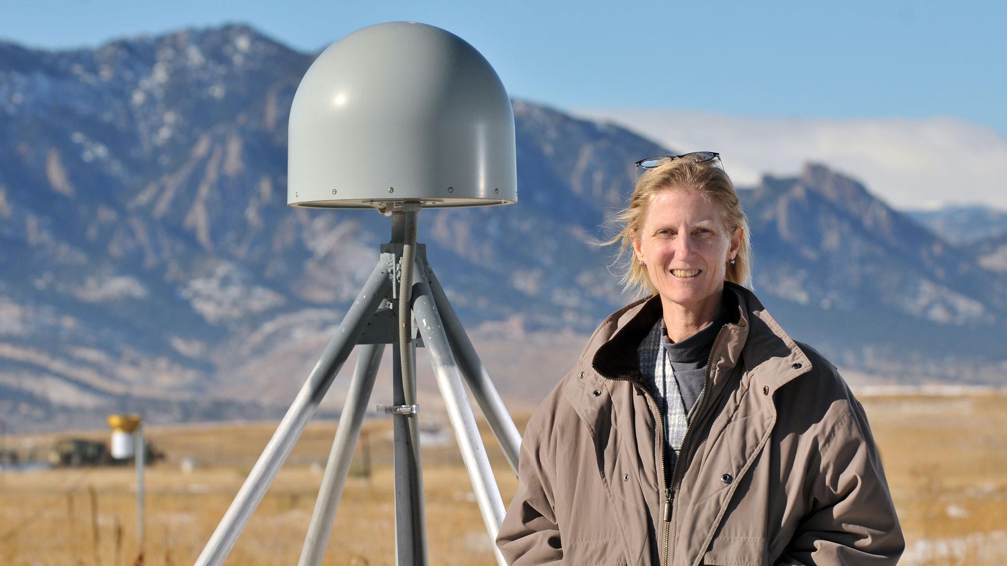 Dr. Kristine M. Larson in front of her favorite GPS site (P041) near Boulder, Colorado. The gray object next to Dr. Larson is a GPS receiver antenna. Photograph by Glenn Asakawa, University of Colorado. Dr. Kristine M. Larson, Professor of Aerospace Engineering Sciences, University of Colorado, Boulder, CO Research interests: Plate tectonics and geodesy, with work developing new ways of using the Global Positioning System (GPS) to study Earth and the water cycle. Research highlights: For many, GPS is a 