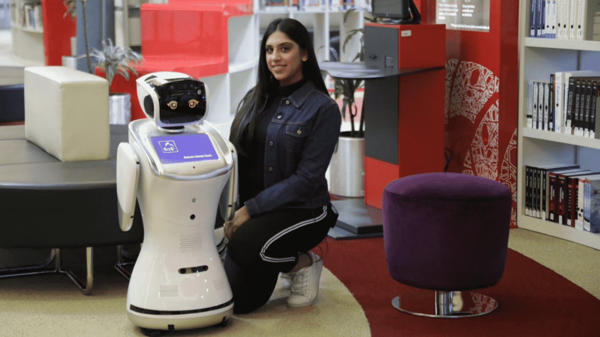 Shaima Almeer next to a robot